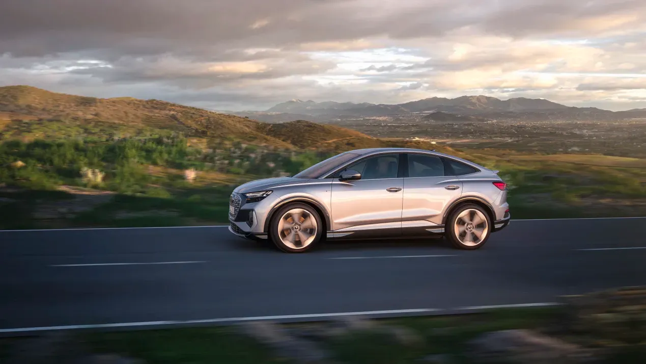 audi q4 e tron sportback driving countryside