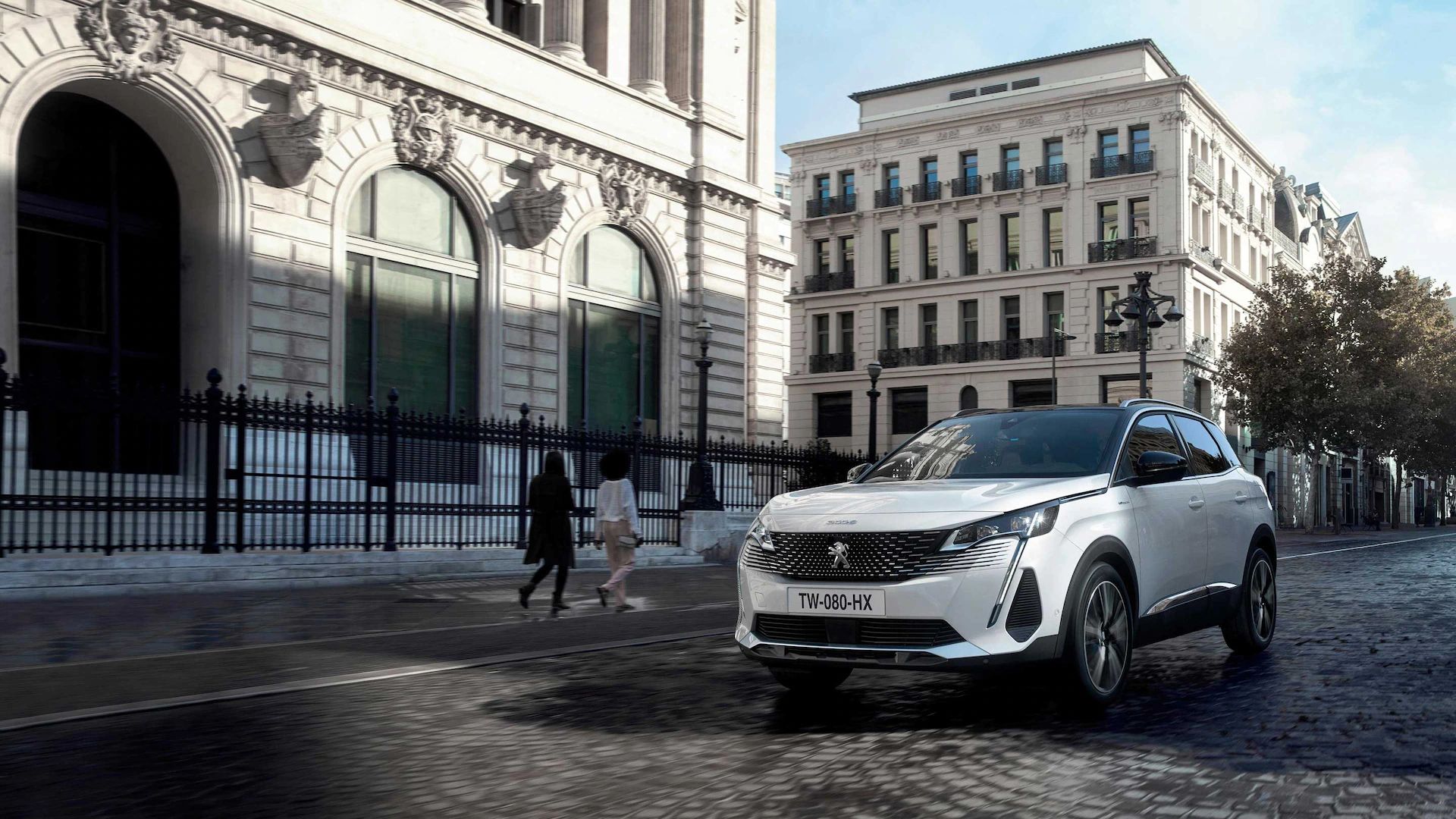 White Peugeot 3008 front driving down the street