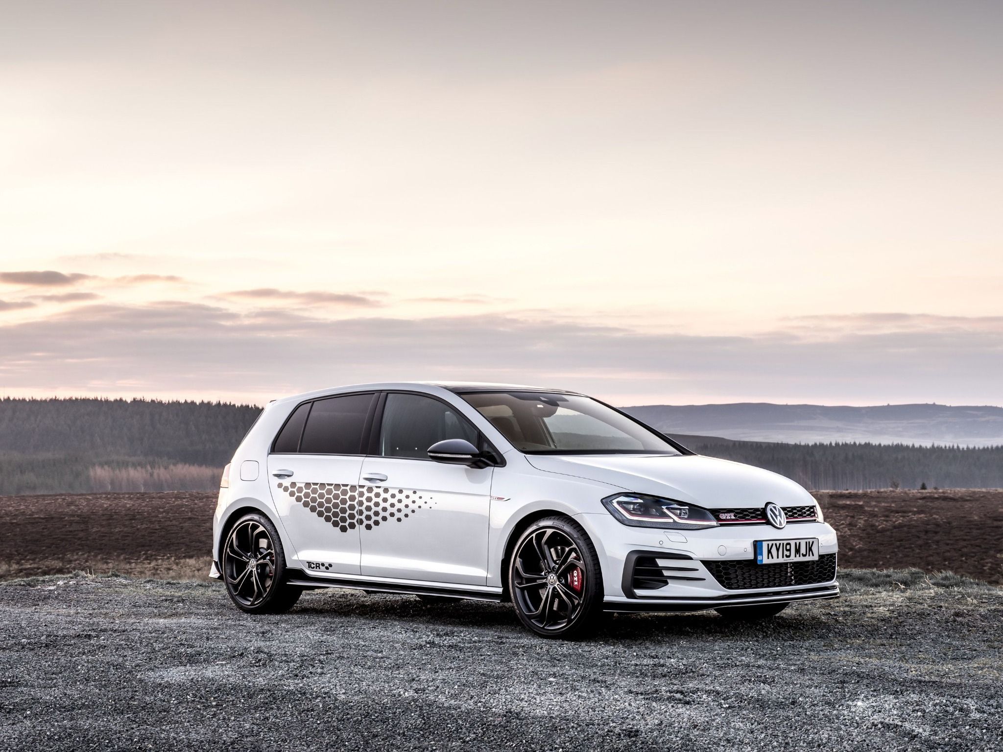 Side view of VW Golf GTI TCR parked on top of mountain