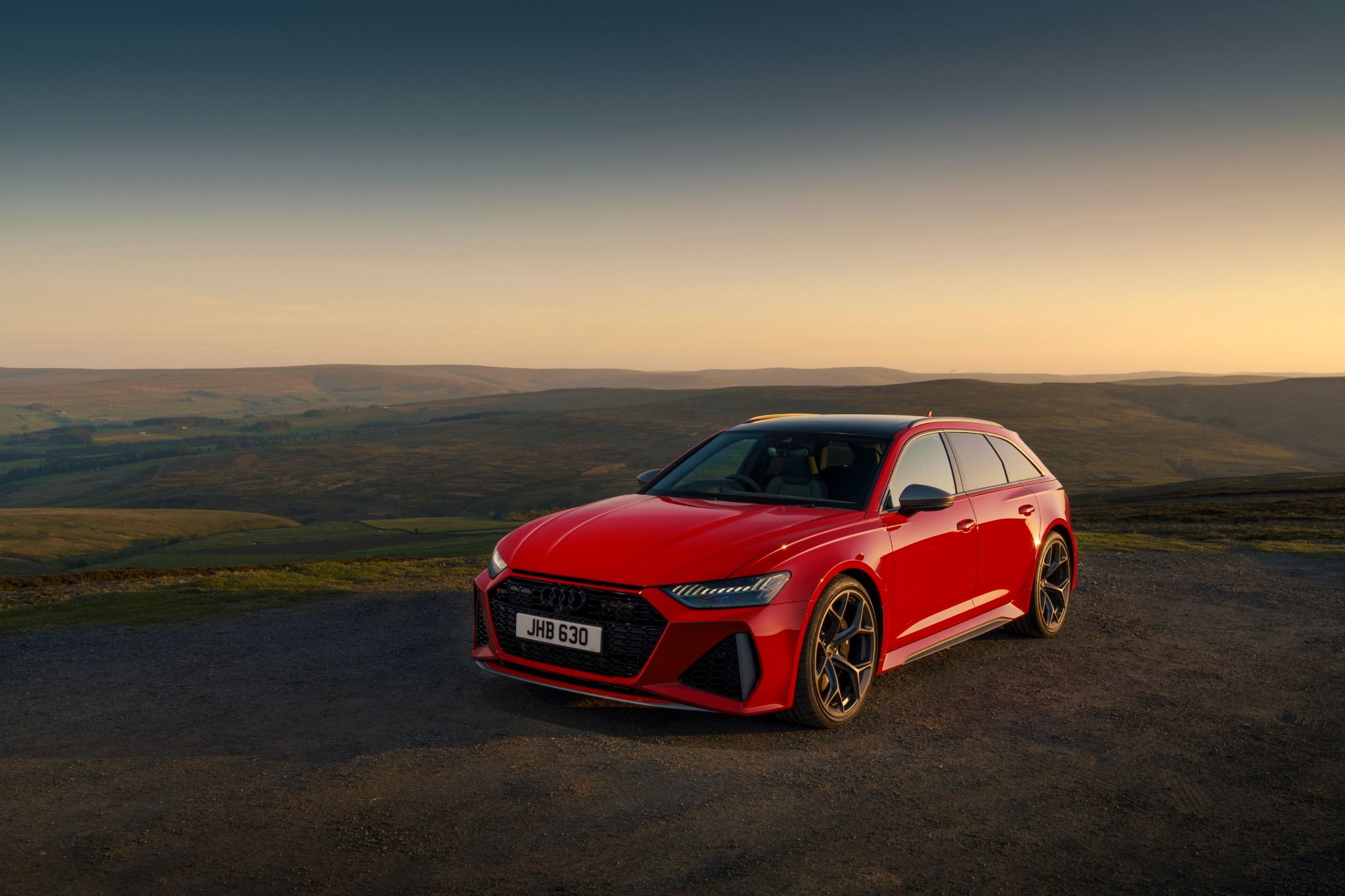 Red 2023 Audi RS6 Avant Performance Parking by a View