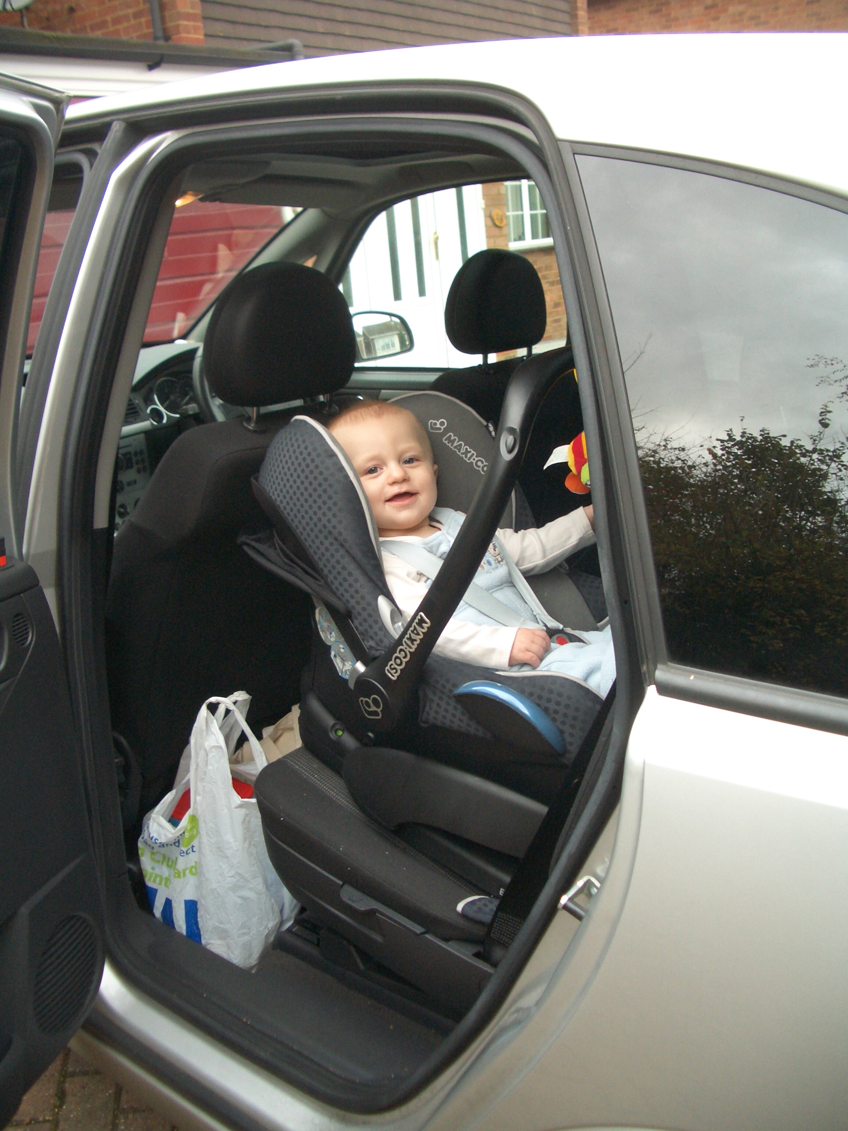Rear facing baby seat in car with isofix