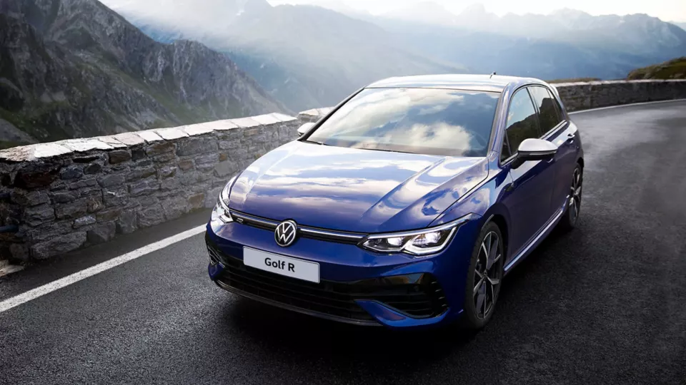 front view of Volkswagen Golf R driving on a road