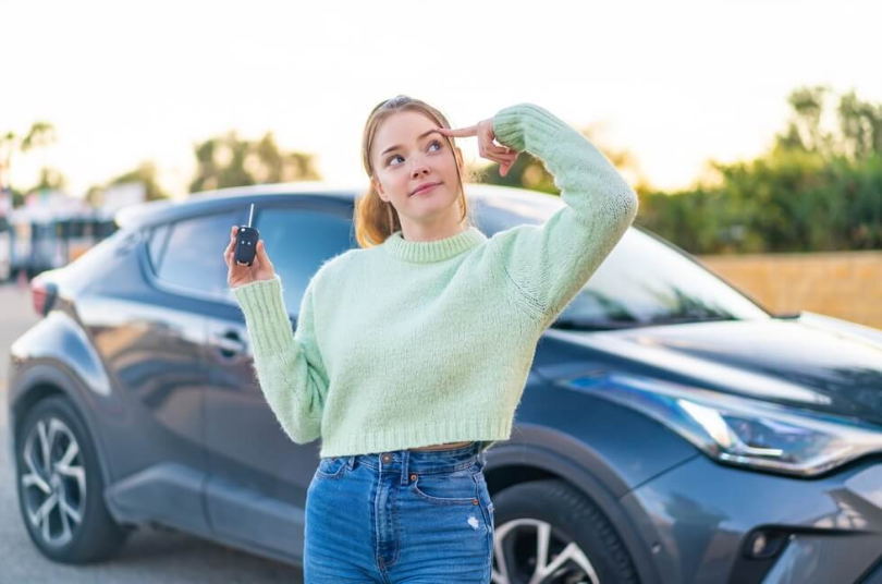 girl holding car keys