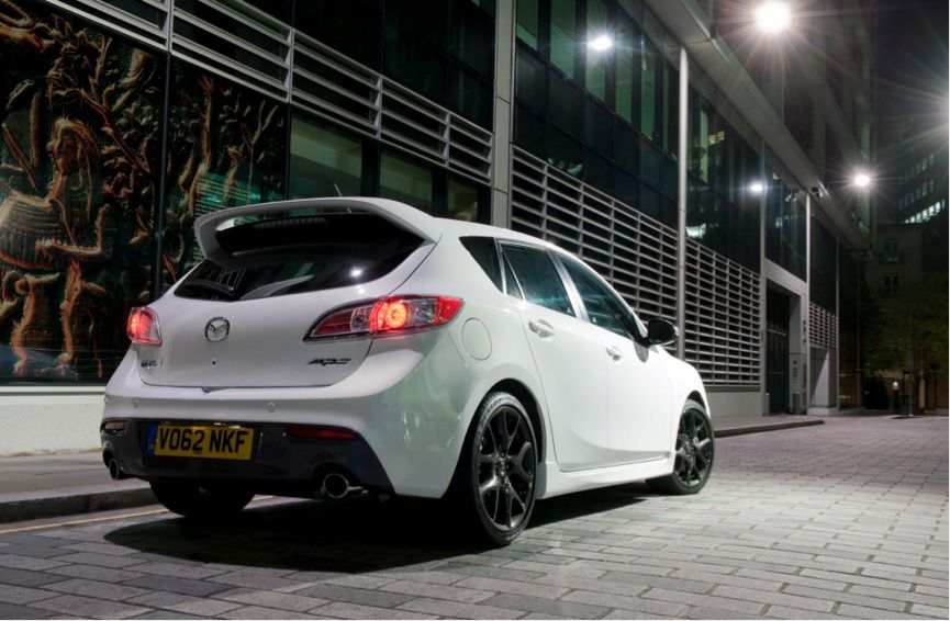 Rear view of a white mazda 3