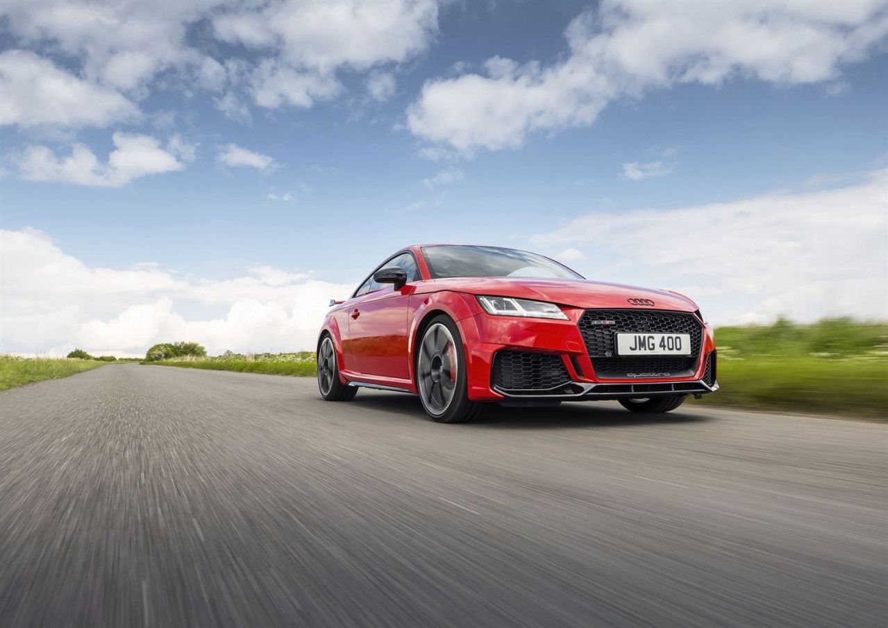 red audi ttrs driving on a road